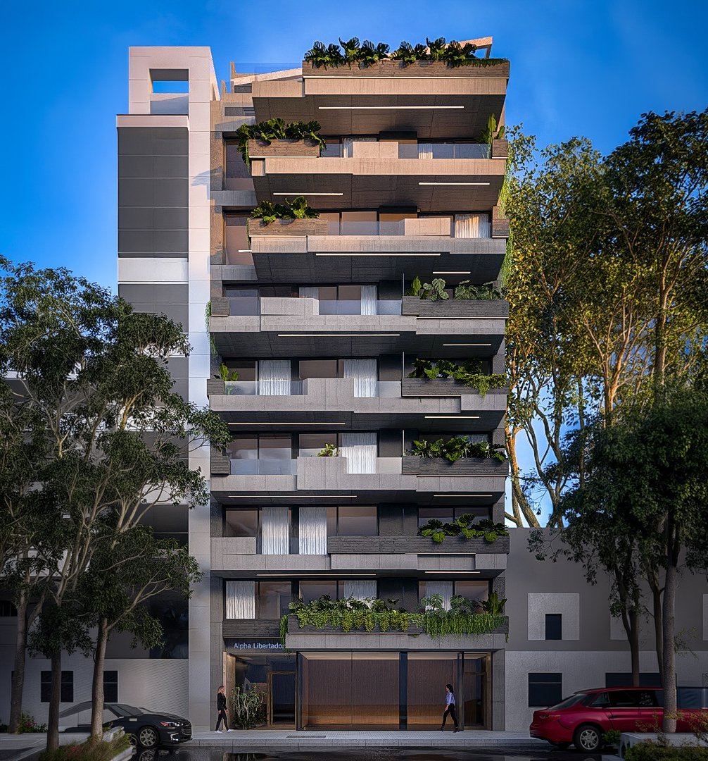 Fachada principal de Alpha Place Libertador — dos órdenes de hormigón visto, vidrio y vegetación